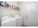 Functional laundry area with appliances and storage space at 2033 Buck Corner Ln, Fuquay Varina, NC 27526