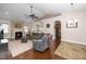 Cozy living room featuring a fireplace, ceiling fan, comfortable seating, and lots of natural light at 2033 Buck Corner Ln, Fuquay Varina, NC 27526