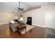 Spacious living room with hardwood floors, comfortable seating, and ceiling fan, ideal for relaxing and entertaining guests at 2033 Buck Corner Ln, Fuquay Varina, NC 27526