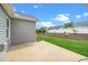 Concrete patio with manicured yard and white fence at 2033 Buck Corner Ln, Fuquay Varina, NC 27526