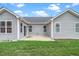 Backyard patio with gray siding home and green lawn at 2033 Buck Corner Ln, Fuquay Varina, NC 27526