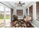 Relaxing sunroom with lots of natural light with sliding glass door and windows with wooden blinds at 2033 Buck Corner Ln, Fuquay Varina, NC 27526