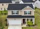 Aerial view of a lovely neighborhood featuring manicured lawns and well-maintained homes in a cul-de-sac at 209 White Farm Dr, Wendell, NC 27591