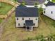 Aerial view of the backyard with a patio and well maintained lawn and landscaping at 209 White Farm Dr, Wendell, NC 27591