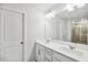 Bathroom featuring double sink vanity and large mirror. Shower visible in background at 209 White Farm Dr, Wendell, NC 27591