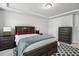 Comfortable bedroom with tray ceiling, neutral walls, and dark wood furnishings at 209 White Farm Dr, Wendell, NC 27591