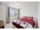 Comfortable bedroom featuring natural light, neutral walls, and a charming quilt on the bed at 209 White Farm Dr, Wendell, NC 27591