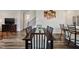 Open-concept dining area featuring dark wood furniture and plenty of natural light at 209 White Farm Dr, Wendell, NC 27591