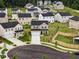 View of new construction homes in a suburban neighborhood with lush green landscaping at 209 White Farm Dr, Wendell, NC 27591