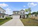 Charming two-story home with a two-car garage and inviting front porch, with fresh landscaping at 209 White Farm Dr, Wendell, NC 27591