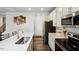 Modern kitchen featuring stainless steel appliances, a white countertop, and modern cabinets at 209 White Farm Dr, Wendell, NC 27591