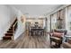 Open-concept living area showcasing the stairs, kitchen, dining space, and comfortable seating at 209 White Farm Dr, Wendell, NC 27591