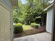 View of the outdoor space including trees and landscaping at 2107 Freeport Dr, Cary, NC 27519