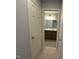 View of the bathroom with a double sink vanity and a mirror at 2107 Freeport Dr, Cary, NC 27519