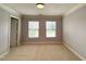 Bedroom featuring carpeting, crown molding, and natural light at 2107 Freeport Dr, Cary, NC 27519