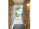 Stone pathway leading to the house with stone walls on either side and a view of the outdoors at 2107 Freeport Dr, Cary, NC 27519