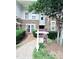 Exterior view of condo with professional real estate signage and lush landscaping at 2107 Freeport Dr, Cary, NC 27519