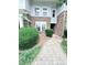 Charming two-story condo with stone accents and a well-manicured front walkway, address 2107 at 2107 Freeport Dr, Cary, NC 27519