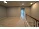 Second floor hallway featuring carpeting and natural light from the doors ahead at 2107 Freeport Dr, Cary, NC 27519