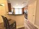 Open kitchen featuring stainless appliances, breakfast bar with stools, wood cabinets at 2107 Freeport Dr, Cary, NC 27519