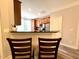 Kitchen with stainless steel appliances, wood cabinets, breakfast bar and adjacent dining area at 2107 Freeport Dr, Cary, NC 27519
