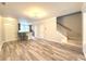 Open-concept living area featuring hardwood floors and staircase leading to the upper level at 2107 Freeport Dr, Cary, NC 27519