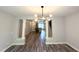 Open-concept living area featuring hardwood floors and staircase leading to the upper level at 2107 Freeport Dr, Cary, NC 27519