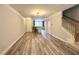 Open-concept living area featuring hardwood floors and staircase leading to the upper level at 2107 Freeport Dr, Cary, NC 27519