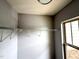 A walk-in closet features wire shelving and a window at 2107 Freeport Dr, Cary, NC 27519