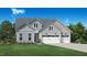Charming two-story home showcasing light gray siding, a well-manicured lawn, and a convenient three-car garage at 2125 Abbeyhill Dr # 88, Raleigh, NC 27610