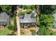 Aerial view of an estate house, showing driveway and walkway lined with beautiful landscaped garden areas at 2190 Keith Hills Rd, Lillington, NC 27546