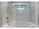 Bathroom features a glass shower door and transom window for natural light at 2190 Keith Hills Rd, Lillington, NC 27546
