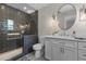 Modern bathroom with a walk-in shower, tile accents, and stylish vanity at 2190 Keith Hills Rd, Lillington, NC 27546
