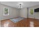 Spacious bedroom with hardwood floors and natural light from two windows at 2190 Keith Hills Rd, Lillington, NC 27546