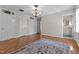 Neutral bedroom featuring hardwood floors, natural light, and ensuite bathroom access at 2190 Keith Hills Rd, Lillington, NC 27546