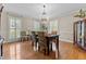 Formal dining room with a chandelier and shuttered windows at 2190 Keith Hills Rd, Lillington, NC 27546