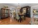 Dining room featuring hardwood floors, a chandelier, and access to other rooms at 2190 Keith Hills Rd, Lillington, NC 27546