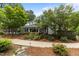 Lush landscaping enhances this home's exterior, creating curb appeal, complemented by a walkway for easy access and scenic views at 2190 Keith Hills Rd, Lillington, NC 27546