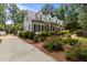View of the house showing the well maintained yard, dormer windows, and driveway at 2190 Keith Hills Rd, Lillington, NC 27546