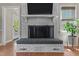 Cozy living room showcasing a whitewashed brick fireplace with a built-in bench at 2190 Keith Hills Rd, Lillington, NC 27546