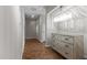 Hallway features parquet floors, modern lighting, and stylish furniture for a refined aesthetic at 2190 Keith Hills Rd, Lillington, NC 27546