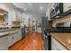 Spacious kitchen with stainless steel appliances and generous countertop space at 2190 Keith Hills Rd, Lillington, NC 27546