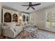 Inviting living room featuring built-in bookcases, ceiling fan, and natural light at 2190 Keith Hills Rd, Lillington, NC 27546