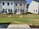 Backyard with green grass and manicured landscaping, ideal for outdoor gatherings at 239 Paramount Dr, Smithfield, NC 27577