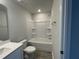 Neutral bathroom features a shower-tub combo, single vanity and tiled floors at 239 Paramount Dr, Smithfield, NC 27577
