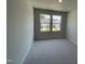 Neutral bedroom featuring carpet floors, a double window, and neutral-painted walls at 239 Paramount Dr, Smithfield, NC 27577