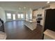 Bright open-concept kitchen/living area with hardwood floors, a center island, and modern appliances at 239 Paramount Dr, Smithfield, NC 27577