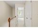 Upstairs hallway with a clear view into a carpeted bedroom, filled with light at 240 Standish Dr, Chapel Hill, NC 27517