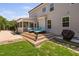 Charming home featuring a spacious back deck, perfect for outdoor relaxation and entertainment with comfortable lounge seating at 2521 Georgianna Dr, Wake Forest, NC 27587