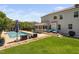 Spacious backyard featuring a pool, covered patio, pergola, and ample green space for outdoor activities at 2521 Georgianna Dr, Wake Forest, NC 27587